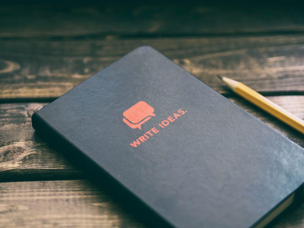 notebook and pencil - why aspiring writers should keep a literary sketchbook